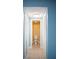 This hallway leads to a bathroom with a toilet, tiled floors and two large closets at 5220 Curry Ford Rd # 303, Orlando, FL 32812
