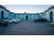 Exterior view of the apartments displaying architectural style, parking area and landscape at 5220 Curry Ford Rd # 303, Orlando, FL 32812