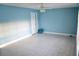 Spacious living room with tile flooring, ceiling fan, and a view of the exterior at 5220 Curry Ford Rd # 303, Orlando, FL 32812