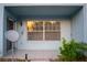 A covered patio with a window, satellite dish and storage area at 5220 Curry Ford Rd # 303, Orlando, FL 32812