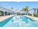 A refreshing swimming pool reflecting the sky with ample space to swim and relax at 5220 Curry Ford Rd # 303, Orlando, FL 32812