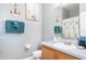 Bathroom with white vanity, nautical decor, and decorative shower curtain at 5502 Willow Bend Trl, Kissimmee, FL 34758