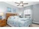 Bedroom featuring natural light, wooden furniture, and beautiful, decorative bedding at 5502 Willow Bend Trl, Kissimmee, FL 34758