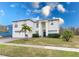 Well-maintained two-story home featuring a manicured lawn and a classic architectural design at 5502 Willow Bend Trl, Kissimmee, FL 34758