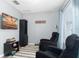 Cozy living room with comfortable reclining chairs and media setup, perfect for relaxing at 5502 Willow Bend Trl, Kissimmee, FL 34758