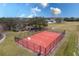 Community basketball court with a gazebo and benches surrounded by green space at 5502 Willow Bend Trl, Kissimmee, FL 34758