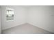 Bedroom with tile floor and window overlooking backyard at 6038 Sw 154Th Place Rd, Ocala, FL 34473