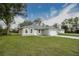 Charming single-story home with a well-maintained lawn, and long driveway at 6038 Sw 154Th Place Rd, Ocala, FL 34473