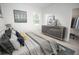 Serene main bedroom with a comfortable bed, soft lighting, and walk-in closet at 6038 Sw 154Th Place Rd, Ocala, FL 34473