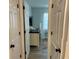 Hallway view to bedroom with modern decor and ample natural light at 6104 Topher Trl # 6104, Mulberry, FL 33860