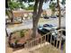 View of the neighborhood from the staircase overlooking landscaping, parking and multiple two-story condominium units at 6104 Topher Trl # 6104, Mulberry, FL 33860