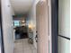 Bright foyer with tile flooring and a view into the open-plan living and dining areas at 6104 Topher Trl # 6104, Mulberry, FL 33860