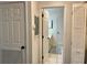 Bright hallway leads to bathroom with tiled floor at 6104 Topher Trl # 6104, Mulberry, FL 33860