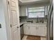 Bright kitchen featuring stainless steel appliances, neutral tile and counters, with stainless sink at 6104 Topher Trl # 6104, Mulberry, FL 33860