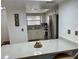 Kitchen featuring a breakfast bar, stainless steel refrigerator, stove, and tile backsplash at 6104 Topher Trl # 6104, Mulberry, FL 33860