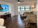 Comfortable living room with hardwood flooring, large windows, and a ceiling fan at 6104 Topher Trl # 6104, Mulberry, FL 33860