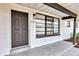 Inviting front porch with updated details, modern windows, and clear house number at 6312 Appian Way, Orlando, FL 32807