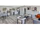 Open-concept living space with modern furniture, sleek floors, and neutral decor at 6312 Appian Way, Orlando, FL 32807