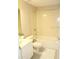 Clean bathroom features a tub/shower combo, white vanity, and tile flooring at 6453 Alcalde Ct # 104, Orlando, FL 32835
