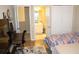 Cozy bedroom with a desk area, closet, and ensuite bathroom at 6453 Alcalde Ct # 104, Orlando, FL 32835