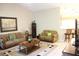 Open concept living room with neutral walls, vaulted ceiling and access to the kitchen at 6453 Alcalde Ct # 104, Orlando, FL 32835