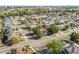 Expansive aerial view of a well-planned residential neighborhood with tree-lined streets, sidewalks, and diverse housing options at 6749 Westlake Blvd, Orlando, FL 32810