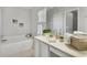 Well-lit bathroom with a tub, a large vanity, and modern fixtures at 6749 Westlake Blvd, Orlando, FL 32810