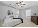 Serene bedroom featuring a ceiling fan, ample natural light, and calming decor at 6749 Westlake Blvd, Orlando, FL 32810