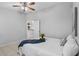 Well-lit bedroom featuring a comfortable bed and a partial view of the kitchen at 6749 Westlake Blvd, Orlando, FL 32810