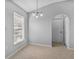 Cozy dining room with ceramic tile floors and a modern light fixture at 6749 Westlake Blvd, Orlando, FL 32810