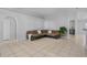 Comfortable living room featuring neutral walls, tile flooring, and natural light at 6749 Westlake Blvd, Orlando, FL 32810