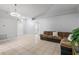 Bright living room with tile floors, light walls, and a cozy seating area at 6749 Westlake Blvd, Orlando, FL 32810