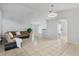 Spacious living room featuring tile flooring, neutral walls, and an open layout at 6749 Westlake Blvd, Orlando, FL 32810