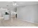 Open-concept living room boasts ceramic tile flooring and neutral paint at 6749 Westlake Blvd, Orlando, FL 32810
