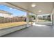 Enclosed patio providing an outdoor living space with views of the fenced backyard and surrounding neighborhood at 6749 Westlake Blvd, Orlando, FL 32810