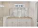 Modern bathroom with double sink vanity and granite countertop at 7110 Sw 134Th St, Ocala, FL 34473
