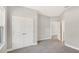 Spacious bedroom with carpet floors, light gray walls, and ample closet space for organized storage at 7110 Sw 134Th St, Ocala, FL 34473