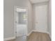 Inviting entryway featuring wood-look flooring and light gray walls that enhance the bright, open space at 7110 Sw 134Th St, Ocala, FL 34473