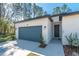 Charming single-story home featuring a well-manicured lawn and a convenient attached two-car garage at 7110 Sw 134Th St, Ocala, FL 34473