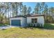 Charming single-story home featuring a well-manicured lawn and a convenient attached two-car garage at 7110 Sw 134Th St, Ocala, FL 34473