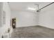 Spacious garage with concrete flooring, hot water heater, and ample room for storage at 7110 Sw 134Th St, Ocala, FL 34473