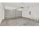 Spacious garage featuring an automatic door, concrete floor, and ample space for storage at 7110 Sw 134Th St, Ocala, FL 34473