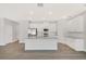 Modern kitchen with granite countertops, stainless steel appliances, and a large center island at 7110 Sw 134Th St, Ocala, FL 34473