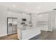Modern kitchen with granite countertops, stainless steel appliances, and a large center island at 7110 Sw 134Th St, Ocala, FL 34473