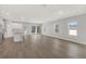 Open floor plan combining kitchen and living area with hardwood floors and plenty of natural light at 7110 Sw 134Th St, Ocala, FL 34473