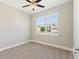 Bedroom featuring a window overlooking a residential street at 804 Colville Dr, Kissimmee, FL 34759