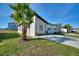 Exterior elevation with well-manicured lawn, modern design, and freshly sealed driveway at 804 Colville Dr, Kissimmee, FL 34759