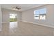 Bright, open concept living room featuring tile flooring, sliding glass door and recessed lighting at 804 Colville Dr, Kissimmee, FL 34759