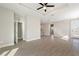 Spacious open-concept living room featuring tile floors, neutral paint, and recessed ceiling at 804 Colville Dr, Kissimmee, FL 34759
