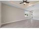 Bright living room with neutral paint, tile flooring, and a ceiling fan at 804 Colville Dr, Kissimmee, FL 34759